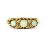 An Edwardian 18ct gold opal and diamond seven stone ring,