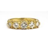 An 18ct gold carved head-style five stone diamond ring,