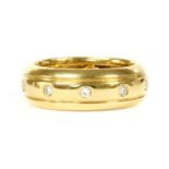A gold diamond set band ring,