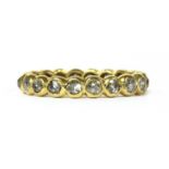 A gold diamond full eternity ring,