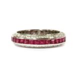 A white gold ruby and diamond half eternity ring,