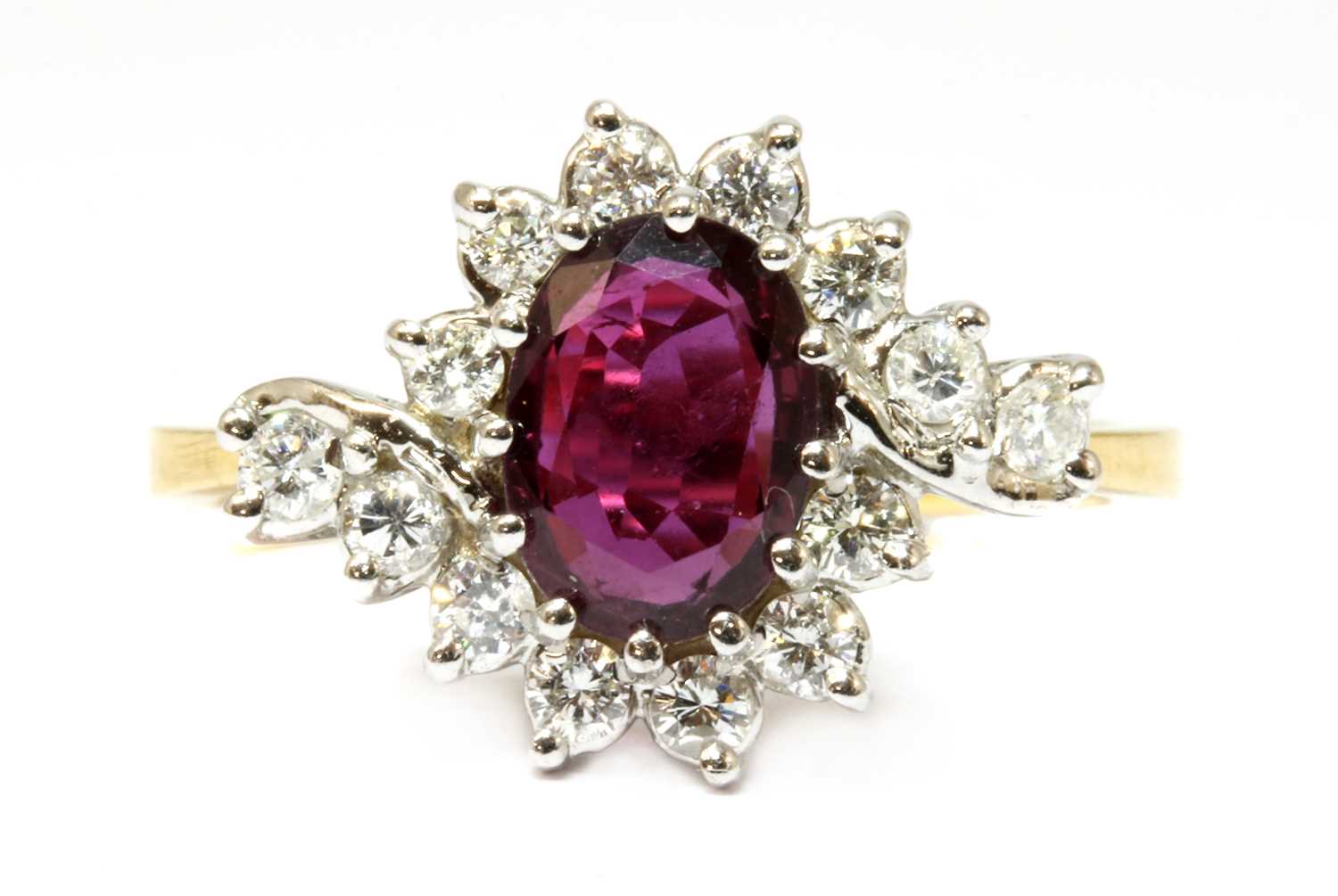 An 18ct gold ruby and diamond crossover cluster ring,