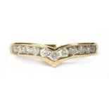 A gold diamond wishbone half eternity ring,