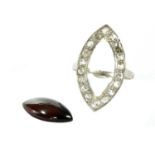 A platinum garnet and diamond navette cluster ring,
