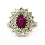 A white gold ruby and diamond cluster ring,