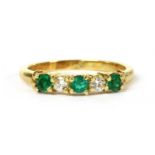 A gold emerald and diamond five stone ring,
