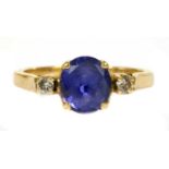 A gold sapphire and diamond three stone ring,