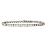 An 18ct white gold diamond line bracelet,