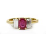 A gold ruby and diamond three stone ring,