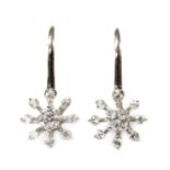 A pair of white gold diamond cluster earrings,