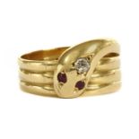 An 18ct gold diamond and ruby set snake or serpent ring,