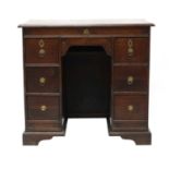 An oak kneehole desk,
