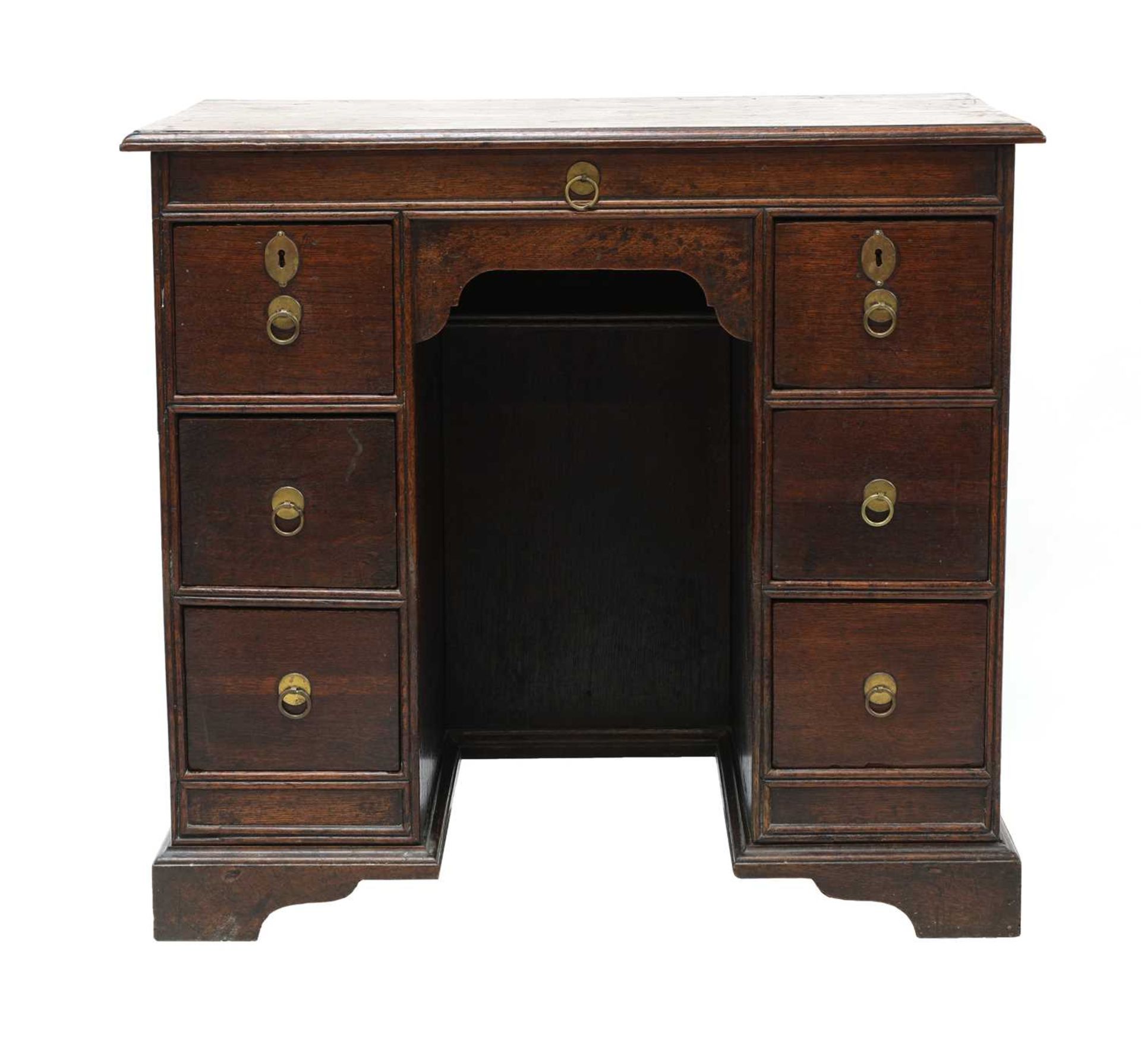 An oak kneehole desk,