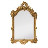 A north European giltwood and gilt composition wall mirror,