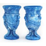 A pair of glass 'gryphon' urns