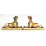 A pair of pottery sphinxes,