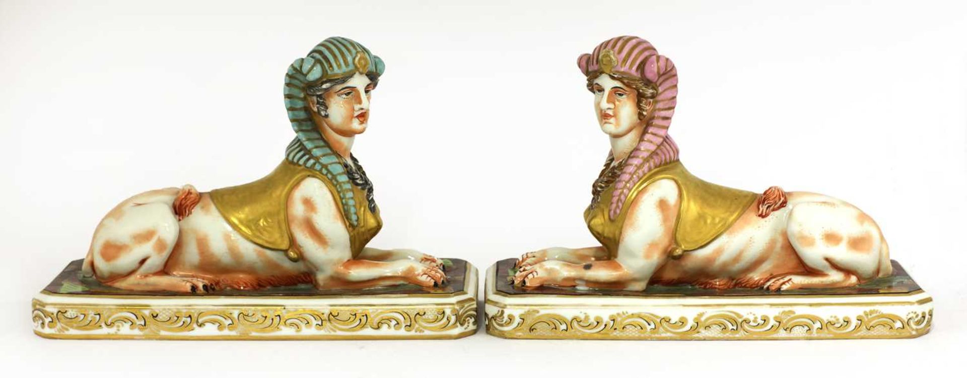 A pair of pottery sphinxes,