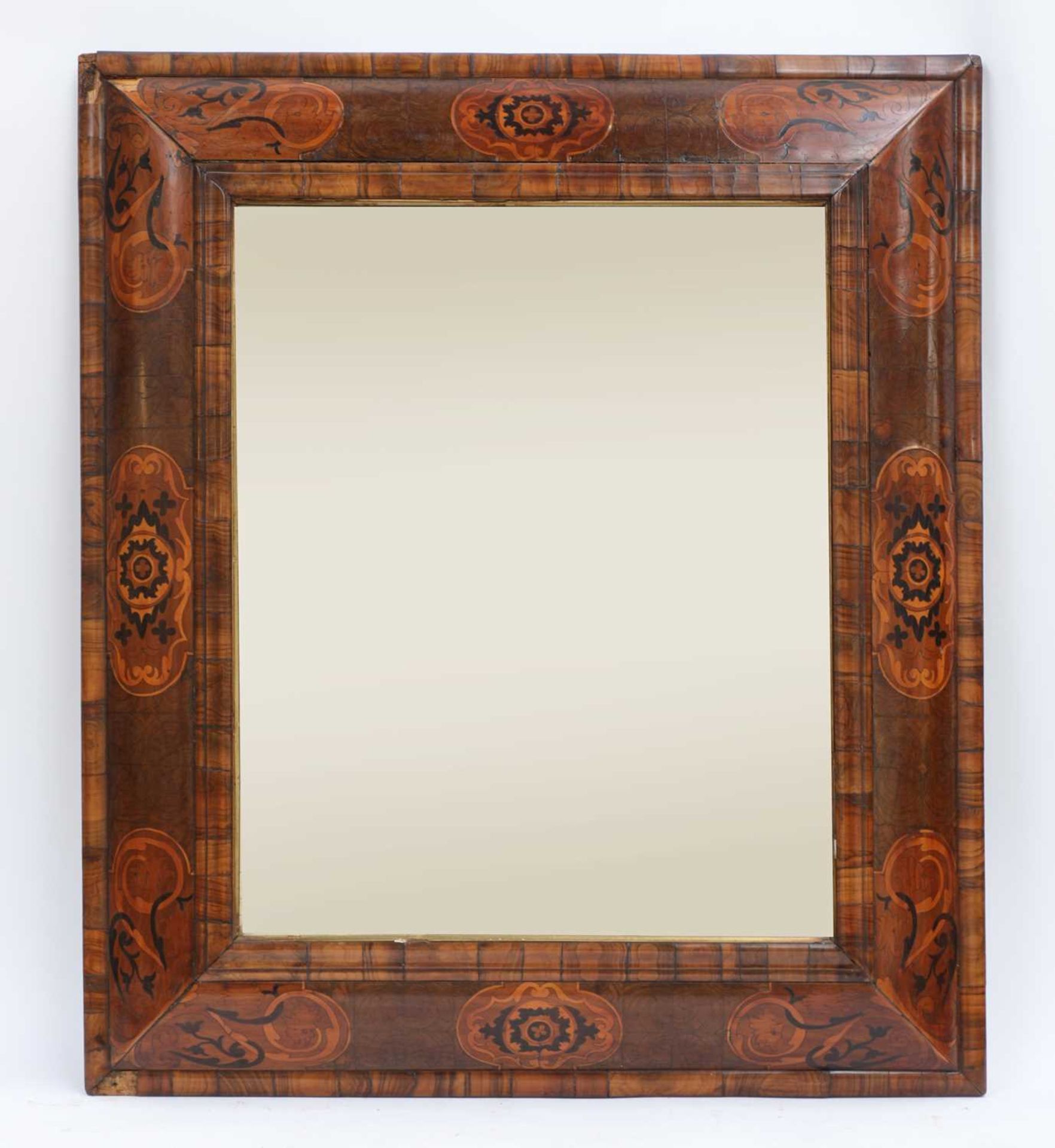 A William & Mary walnut and marquetry cushion-framed mirror,