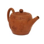 A Staffordshire redware small ovoid teapot and cover,