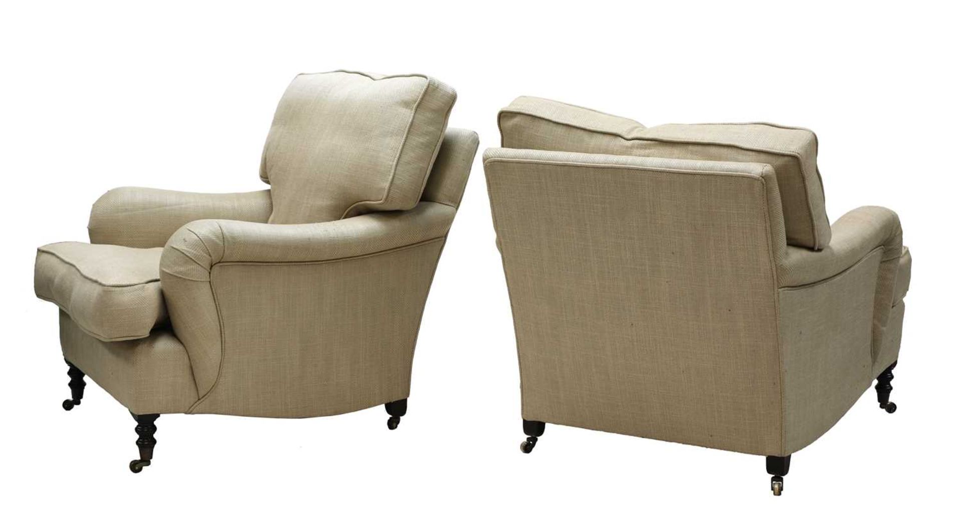 A near pair of easy armchairs