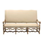 A French bleached oak three-seater sofa,