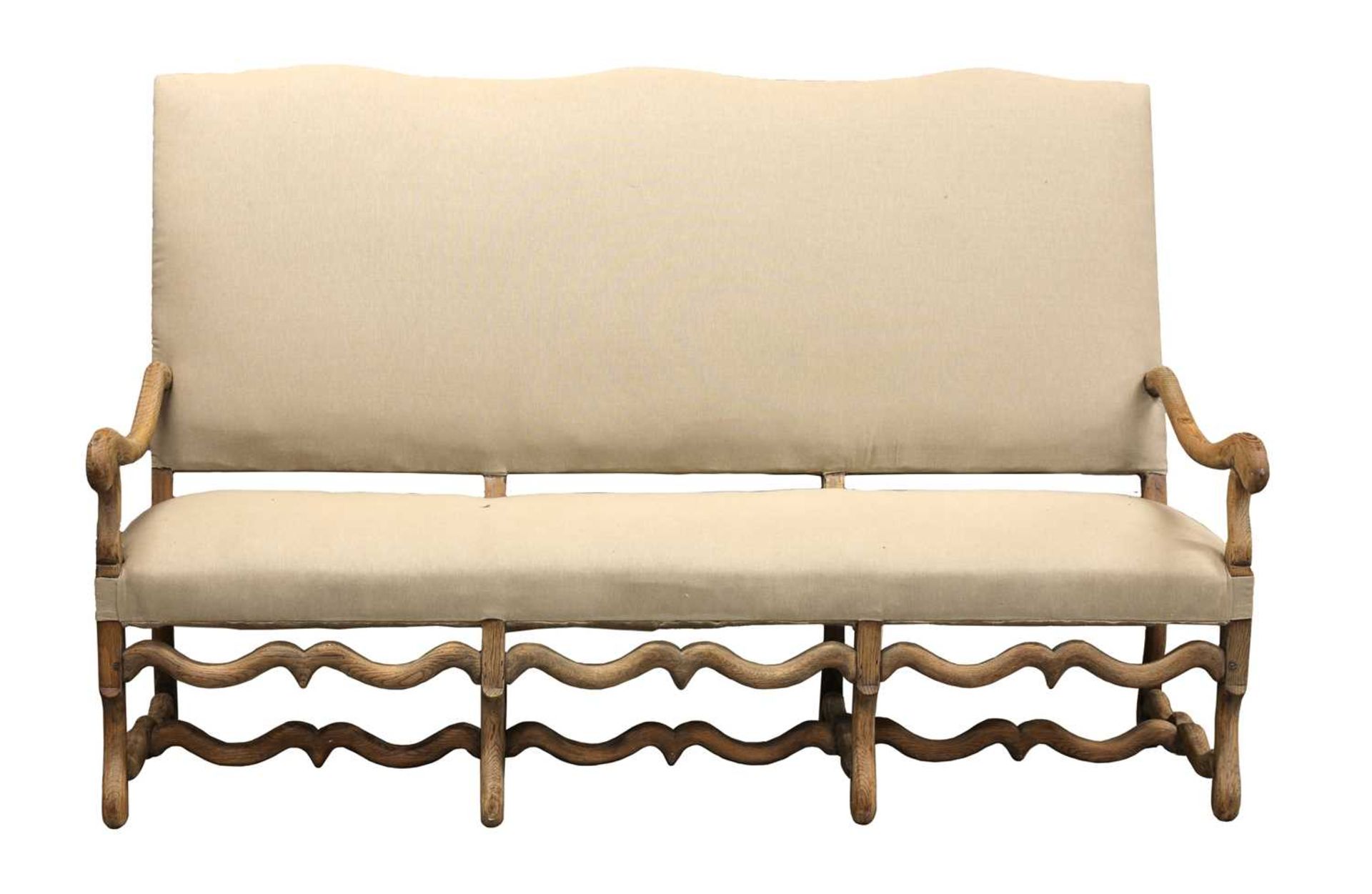 A French bleached oak three-seater sofa,