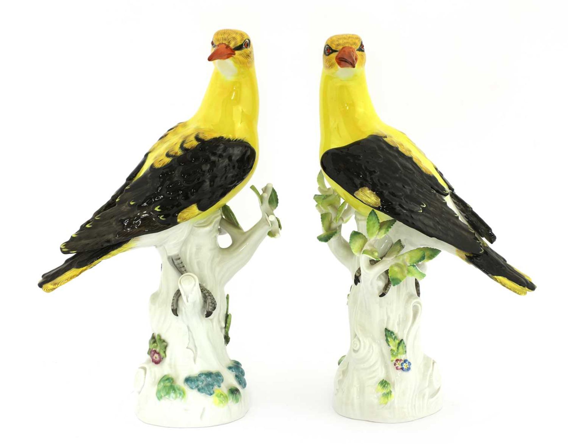 A pair of Meissen porcelain models of golden orioles,