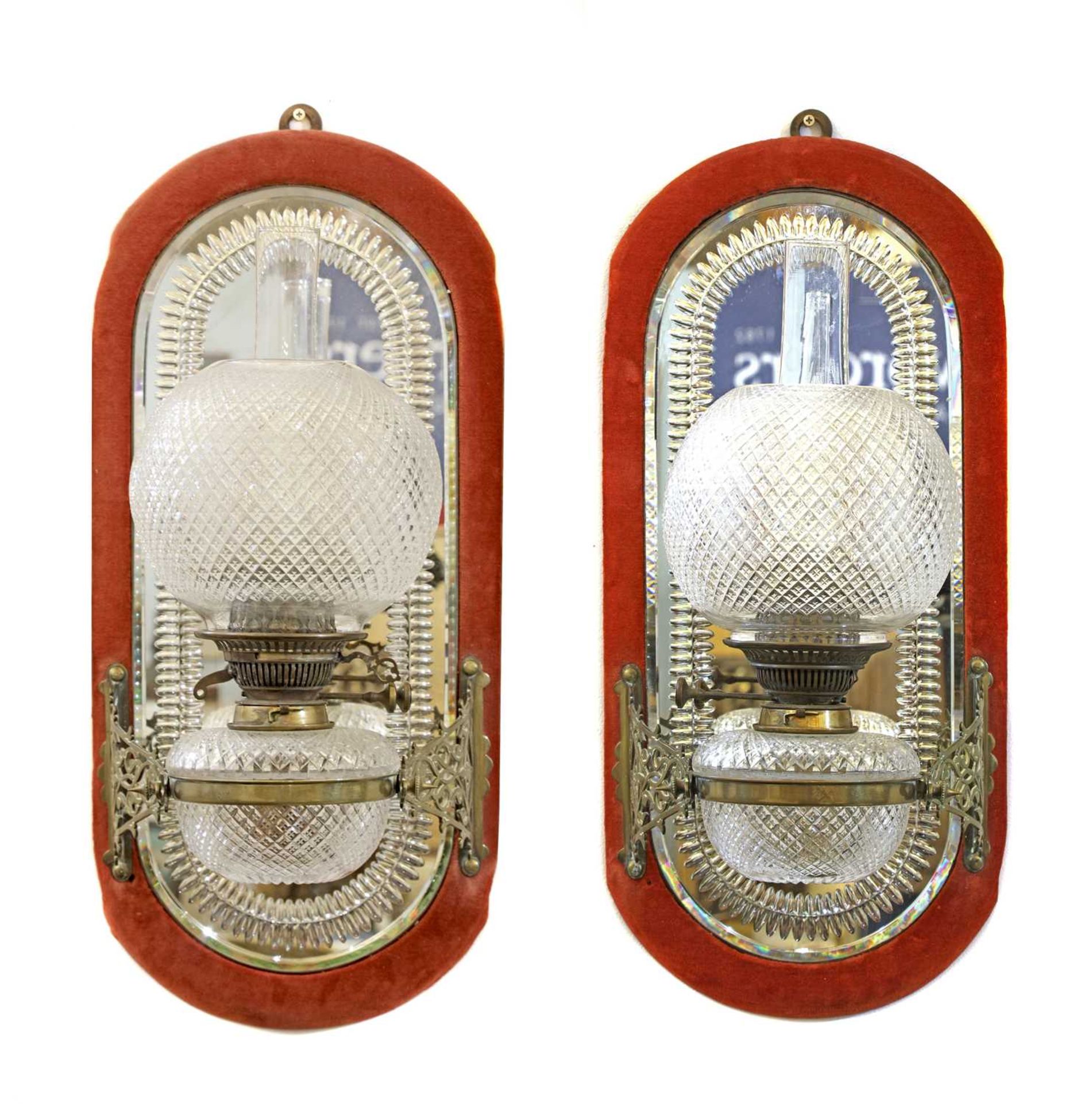 A pair of brass and glass girandole oil wall lights,