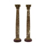 A pair of painted faux marble Corinthian columns