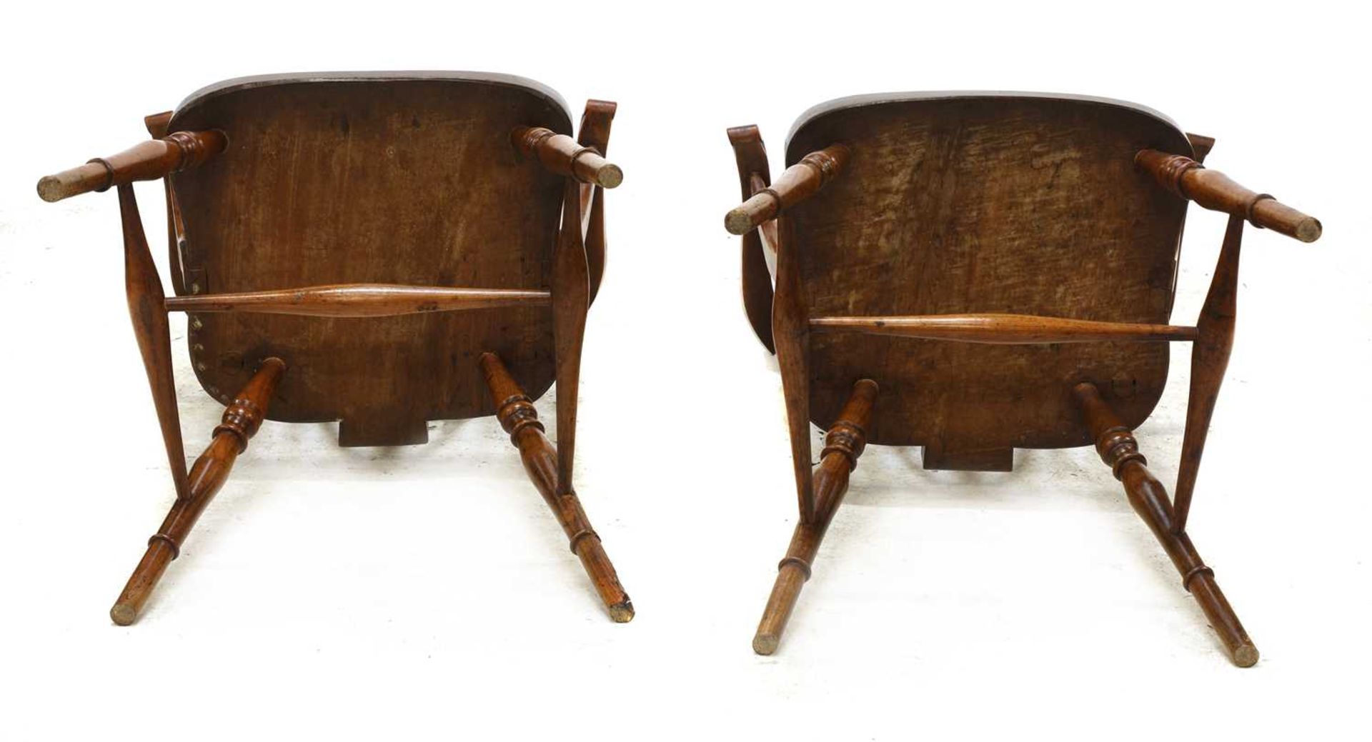 A set of four walnut and fruitwood wheel back Windsor chairs, - Image 4 of 5