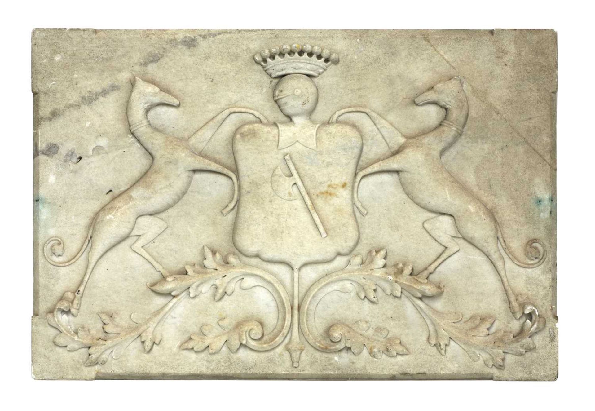 A carved marble coat of arms,