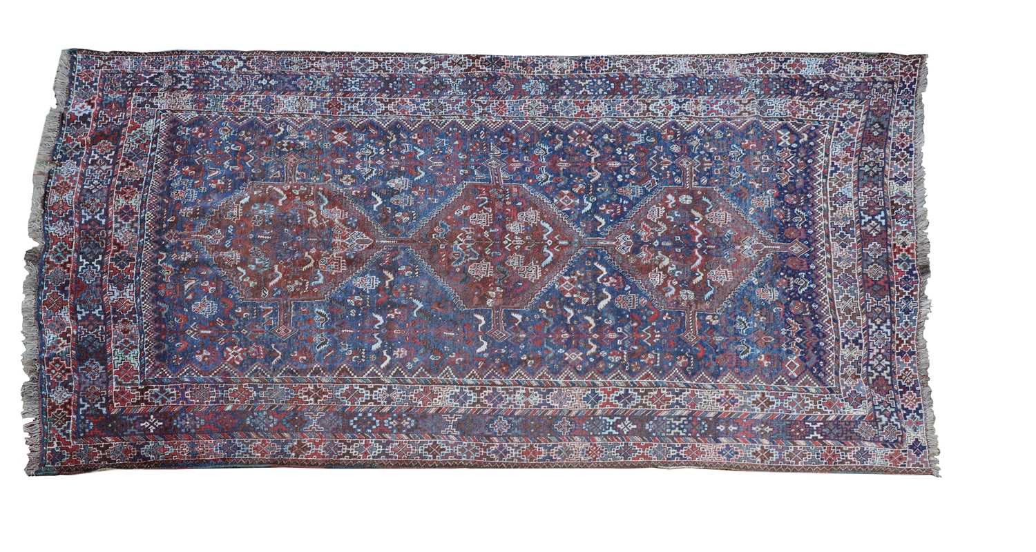 A Persian Khamseh carpet,