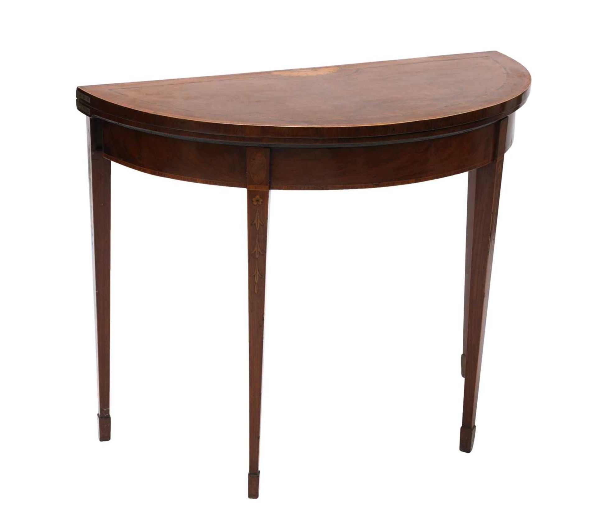 An Edwardian mahogany demilune fold-over card table,