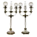 A pair of cut glass and gilt brass electric lamps,