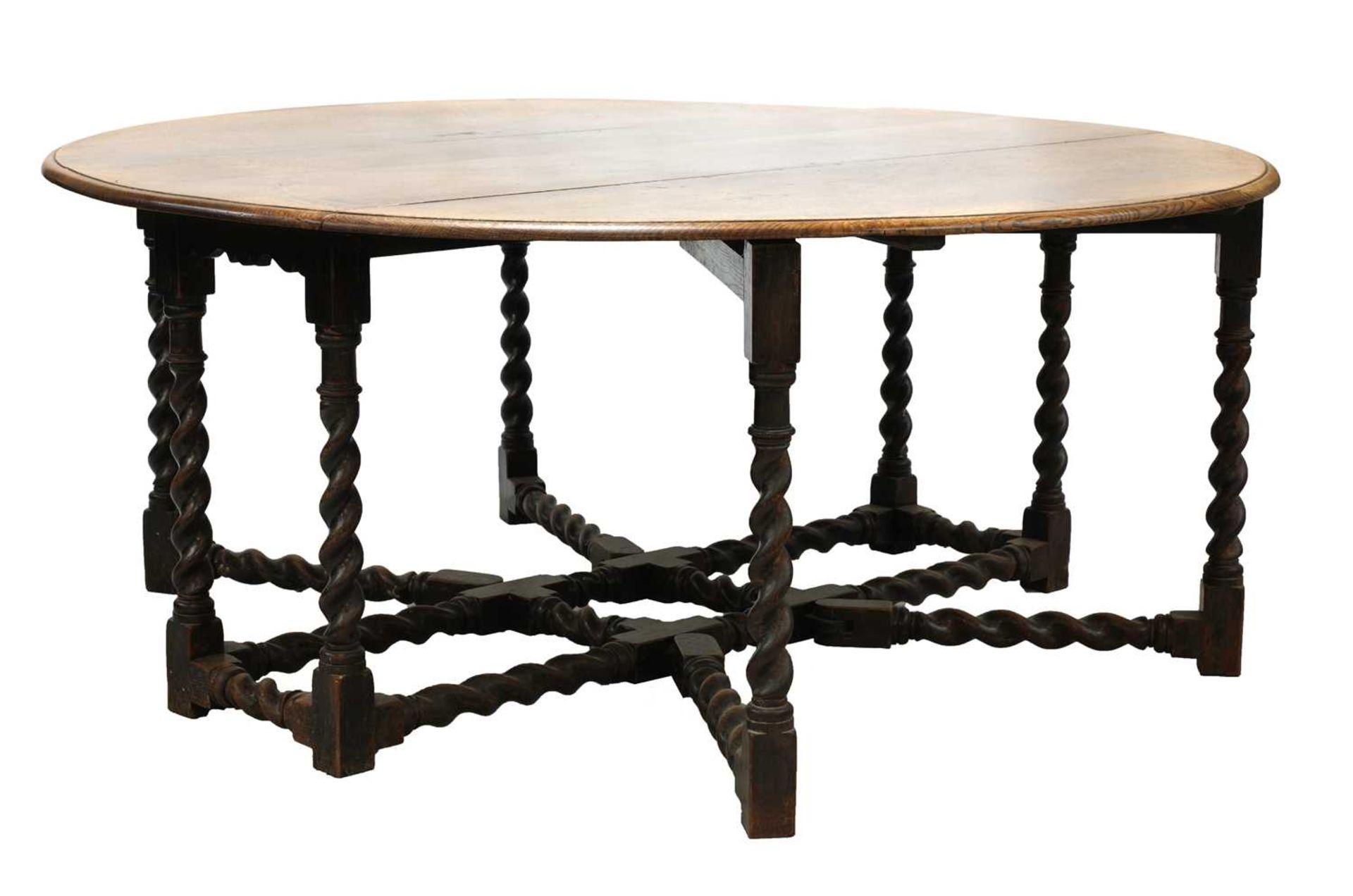 A ten-seat, 17th-century-style, oak double gateleg table,