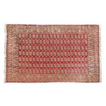 An Afghan carpet of Bokhara design,