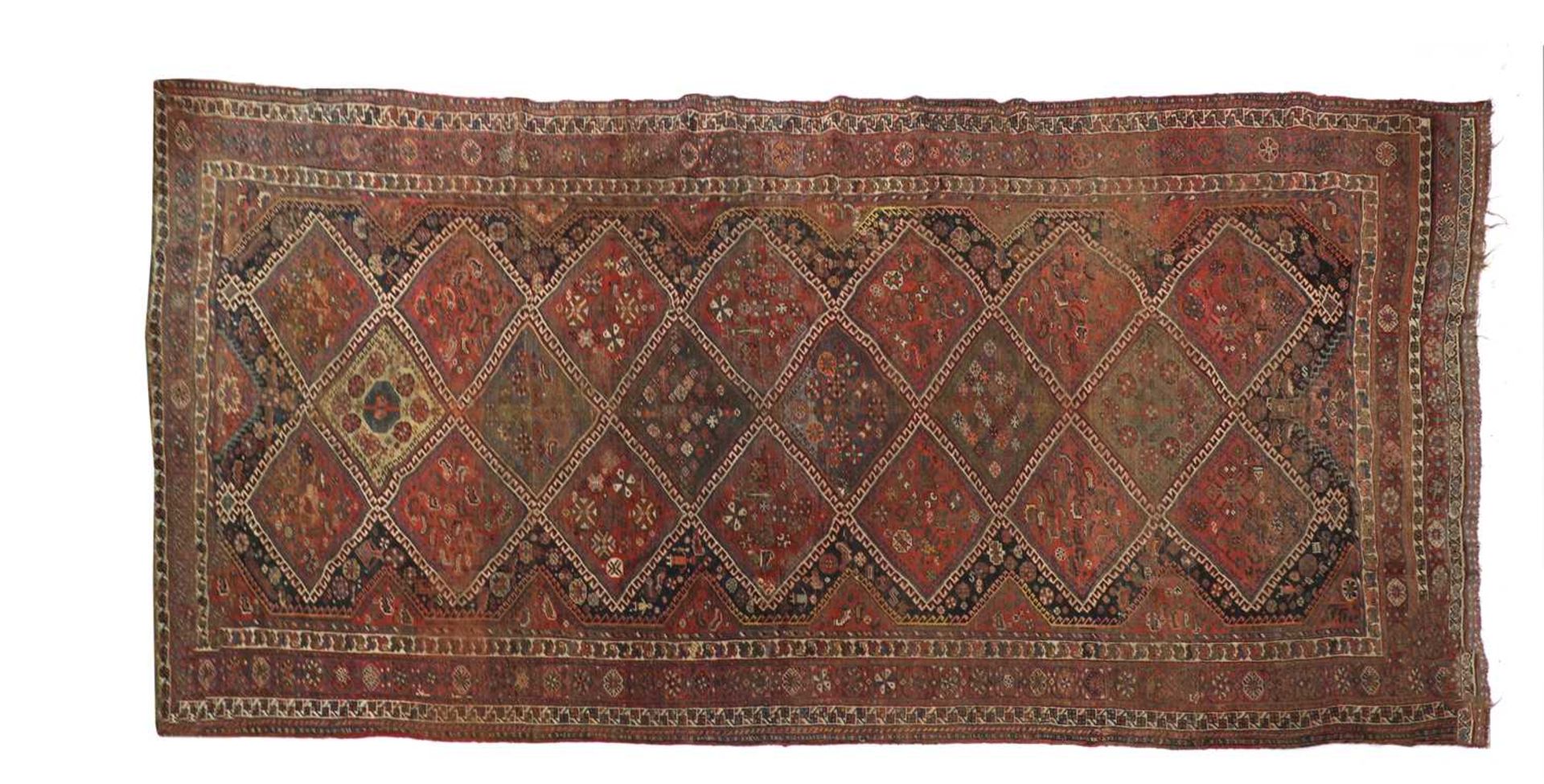 A red ground Persian carpet,