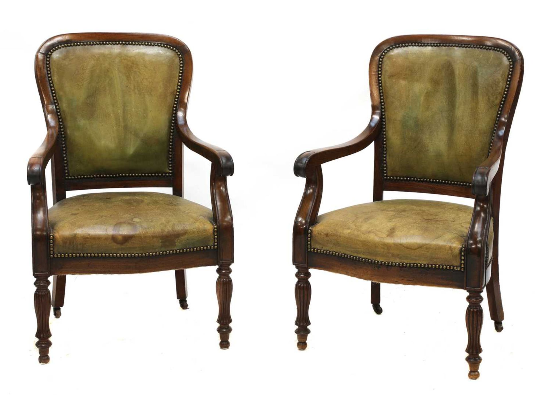 A pair of French Louis Philippe mahogany library armchairs