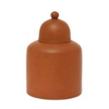 A rare Staffordshire redware straight-sided tea canister and domed cover,