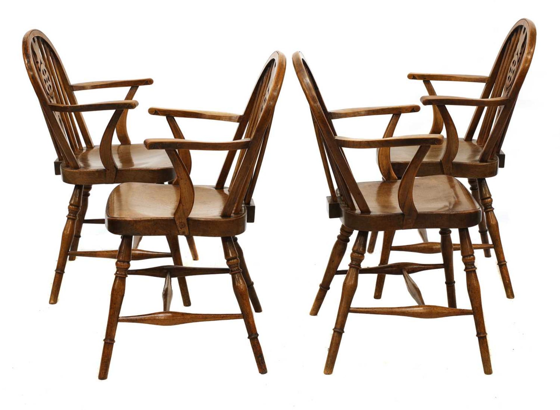 A set of four walnut and fruitwood wheel back Windsor chairs, - Image 2 of 5