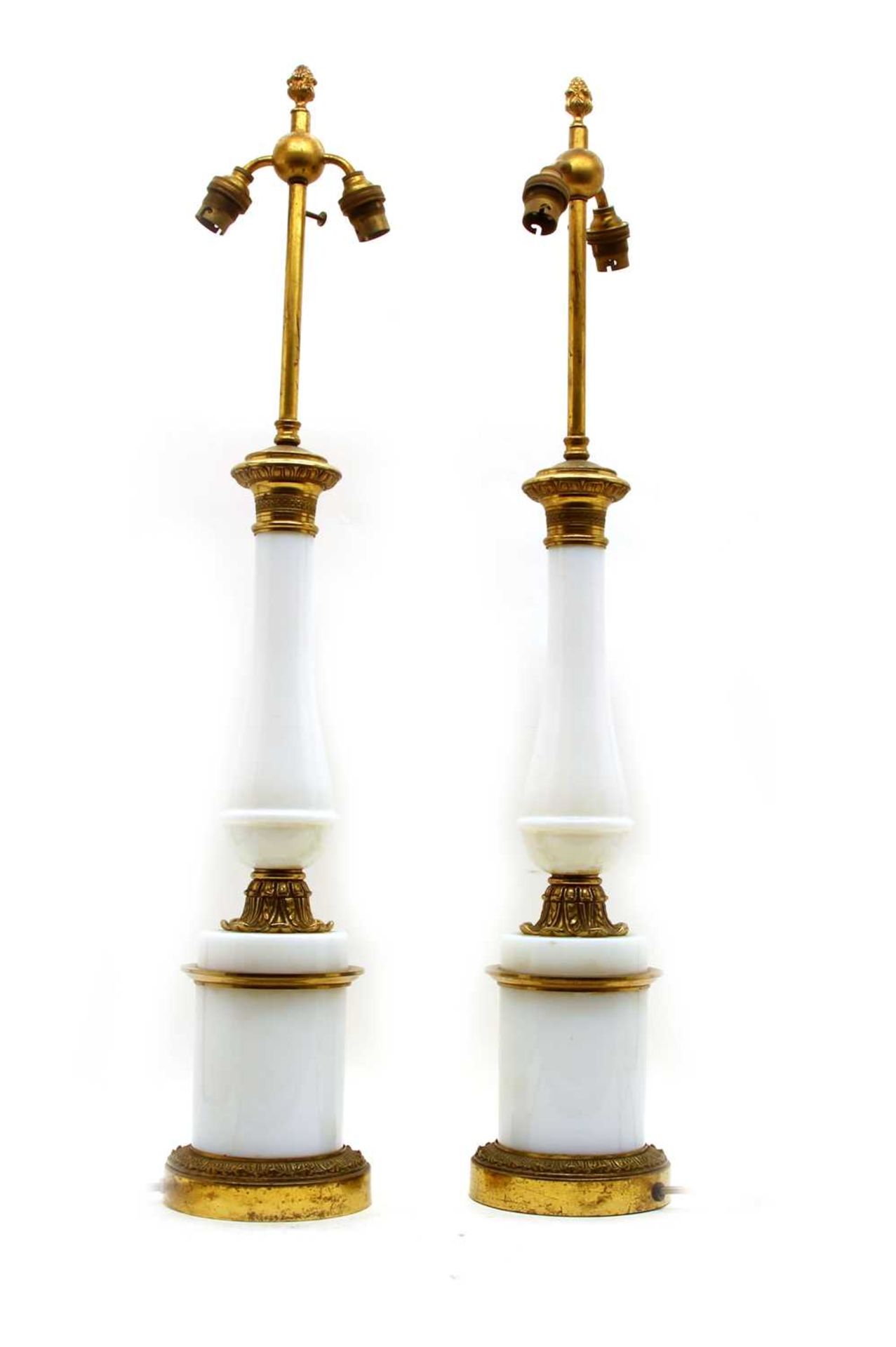 A pair of opaline glass and gilt metal table lamps,