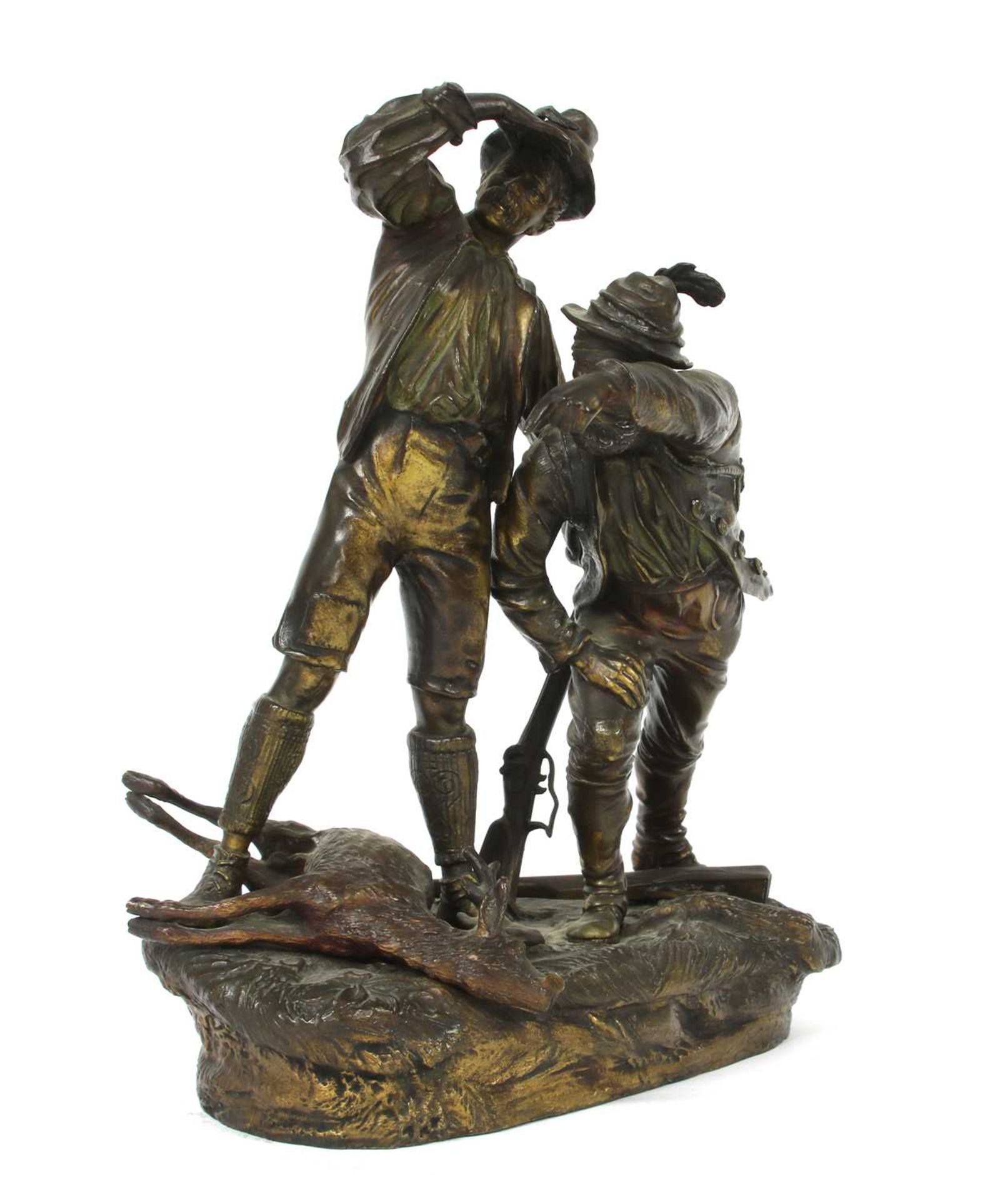 An Austrian cold-painted bronze group of two hunters with a dead stag,