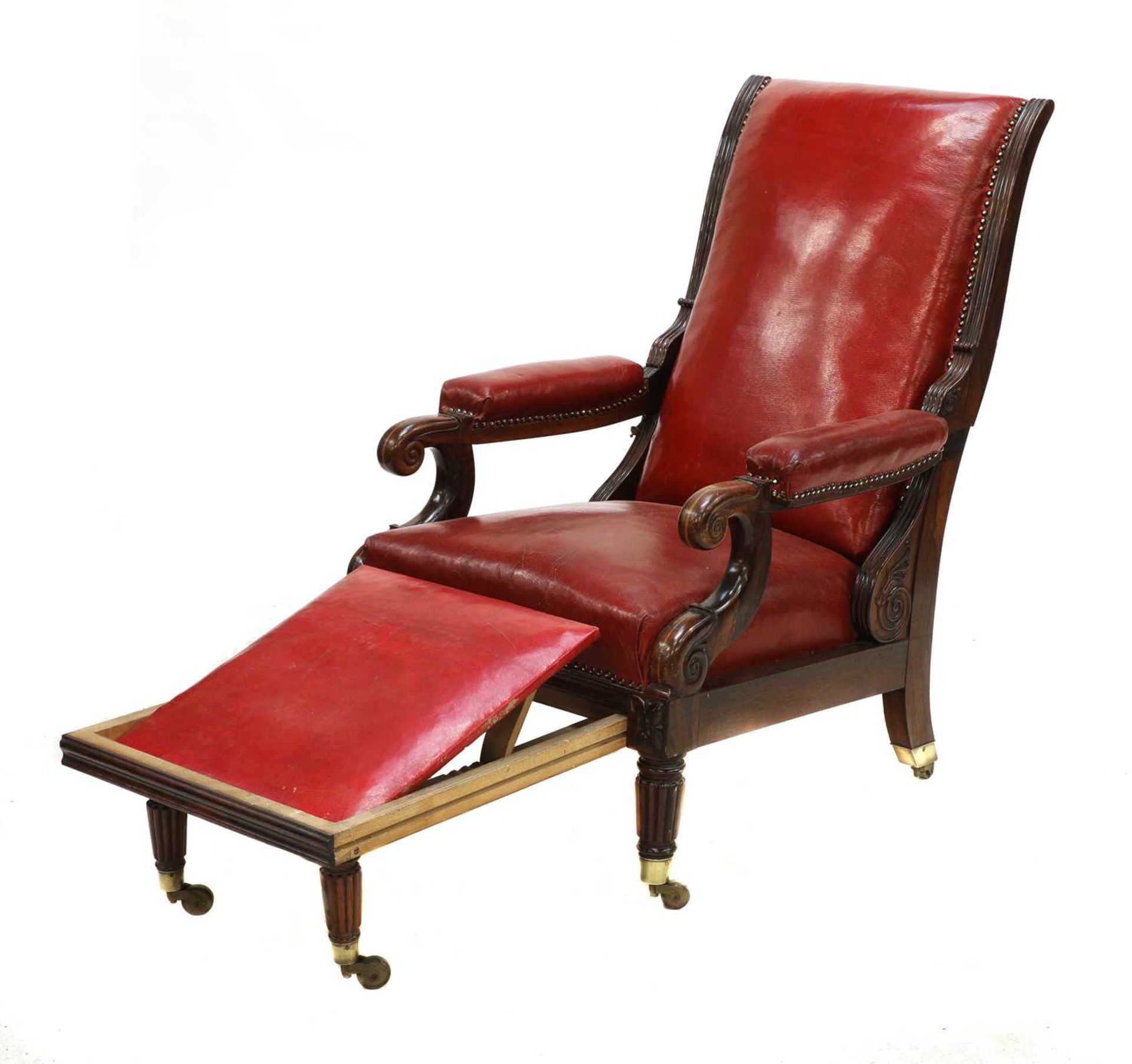 A rosewood reclining library armchair,