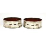 A pair of Scottish William IV silver presentation coasters in the form of dog collars,