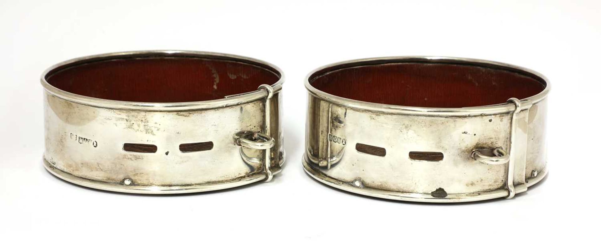 A pair of Scottish William IV silver presentation coasters in the form of dog collars,