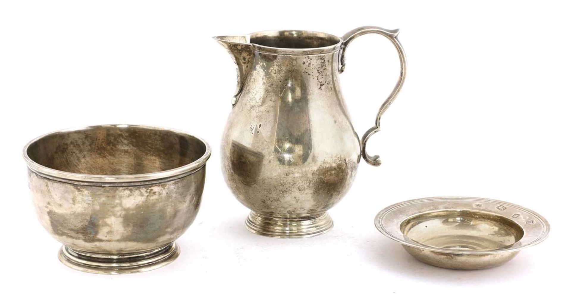 A silver jug,