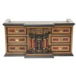 A Continental walnut, ebonised and brass inlaid table cabinet,