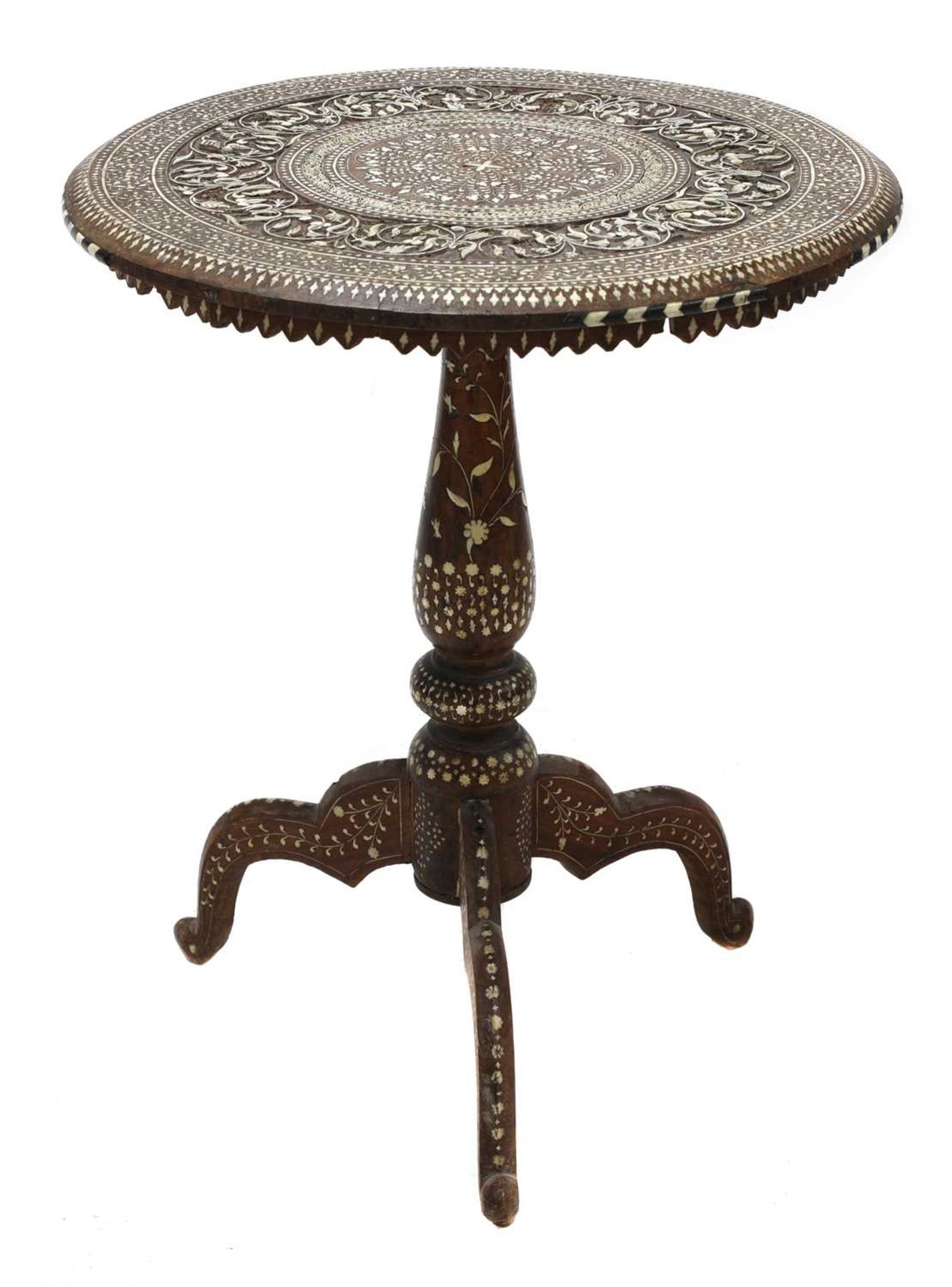 An Indian tripod table,