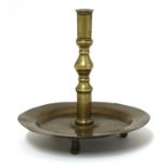 A brass candlestick,