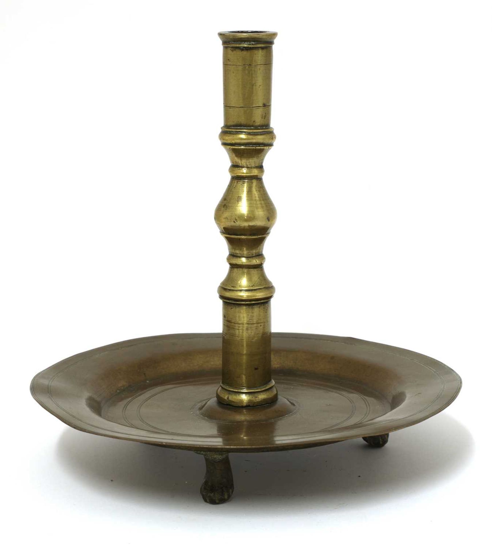 A brass candlestick,